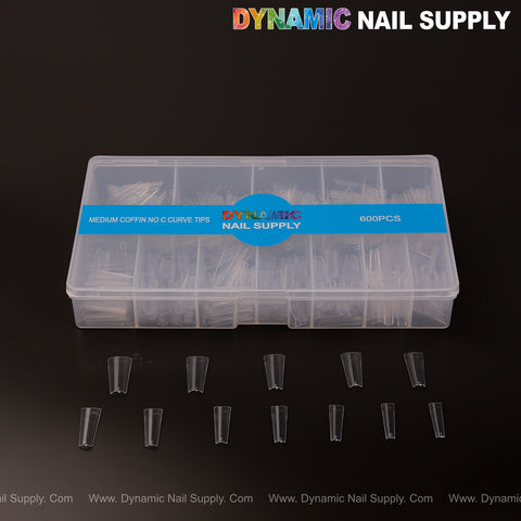 A box labeled Medium Coffin Nail Tips Half Cover - 600 pcs - 12 sizes holds clear medium coffin nail tips on display.