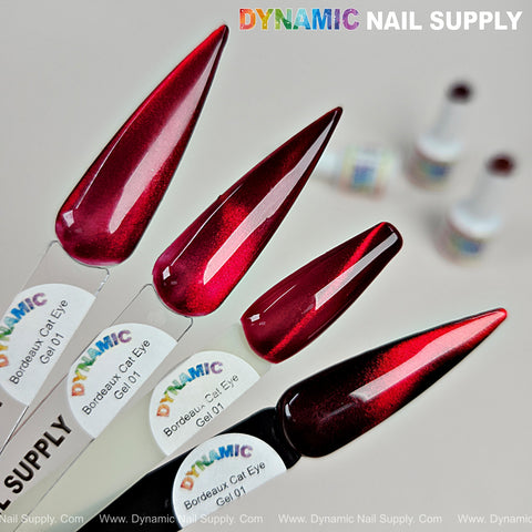 Four nail swatches show Bordeaux Cat Eye #1s glassy red wine shimmer gel polish on labeled sticks with blurred bottles.