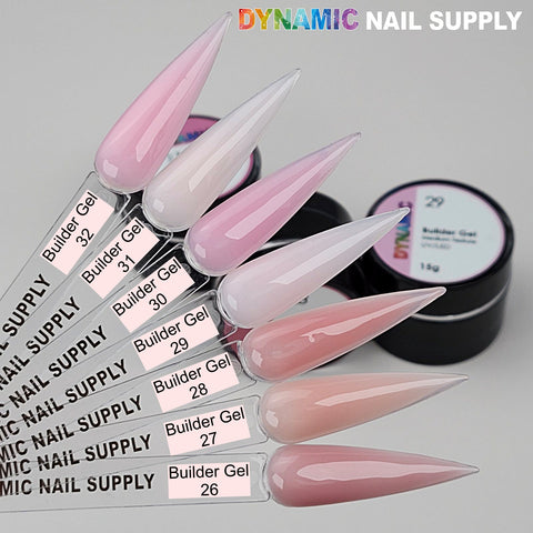 Seven long pink and nude nail extensions on labeled sticks; HEMA-free Builder Gel Pod containers in the background.