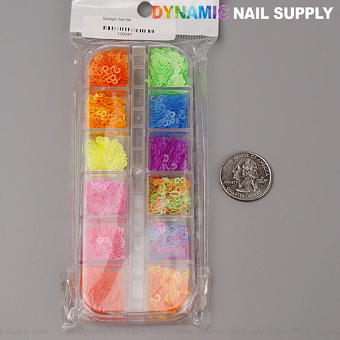 Colorful Neon Nail Sequins Number Charms shown next to a U.S. quarter for size on a gray surface.