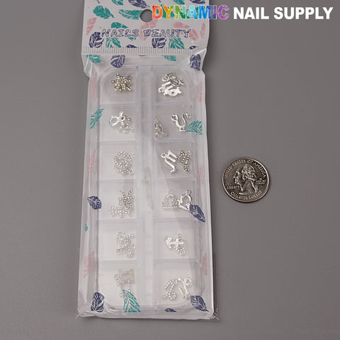 24 pcs Silver Zodiac Sign Charms & Rhinestone Gems for Nail Art, DYNAMIC NAIL SUPPLY text shown above US quarter.