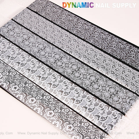 Nail Art Design Foils - White and Black Lace Nail Foil: five stylish strips displayed diagonally on a white surface.