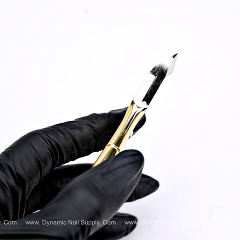 A gloved hand holds the D555 Professional Cuticle Nippers with high-tension spring and full jaw, against a white background.