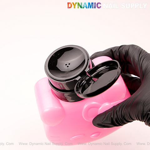 A gloved hand opens a black top on a pink Hello Kitty refillable bottle; Dynamic Nail Supply text above.