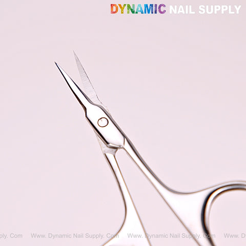 Close-up of NT1216 Silver Professional Curved Tip Cuticle Scissors, stainless steel, with sharp curved blades on white.