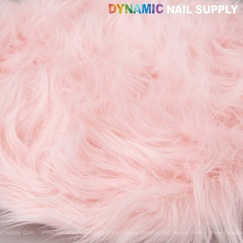 A close-up of the Light Pink Faux Fur Fabrics Round Display Mat for nail art photography, text DYNAMIC NAIL SUPPLY in corner.