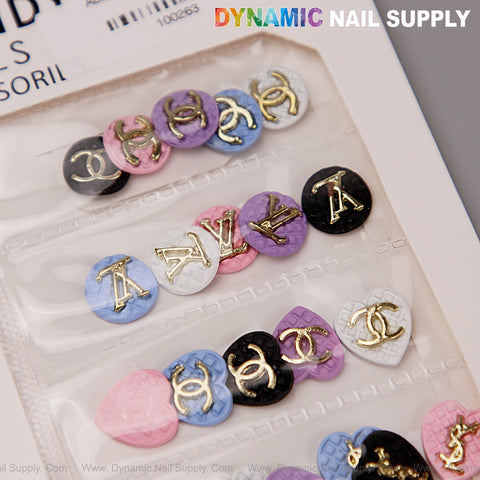 LV Logo Heart Shape Resin Charms in black, white, pink, blue & purple for nail design by Dynamic Nail Supply.