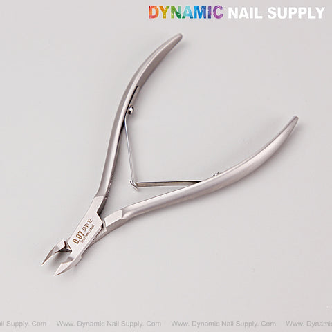 D07 - Jaw 12 stainless steel cuticle nippers on light background, DYNAMIC NAIL SUPPLY text at top right.