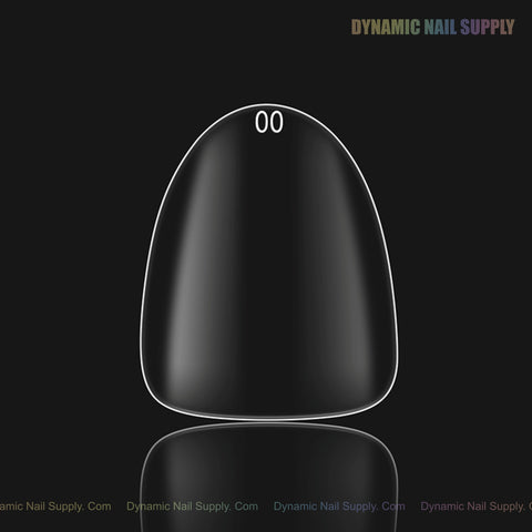 A Sculpted Almond (Short) Full Cover Soft-Gel Nail Tip (Pink Box), size 00, is centered on black; Dynamic Nail Supply above.