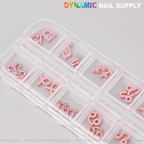 24 pcs Pink Rhinestone Zodiac Sign Charms—Nail Art DIY Accessories by DYNAMIC NAIL SUPPLY, top right labeled.