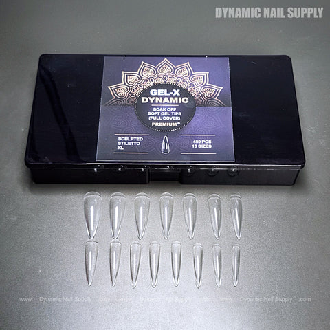 A black box labeled Sculpted Stiletto XL with 15 clear full cover soft-gel nail tips arranged below it.