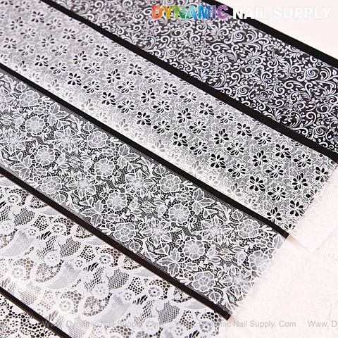 Five strips of Nail Art Design Foils – White and Black Lace feature intricate floral and swirl patterns for elegant nails.