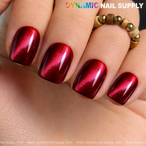 Close-up of four nails in Bordeaux Cat Eye #3, a glassy red wine magnetic shimmery gel polish.
