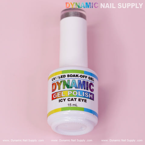 A 15 ml white bottle of Dynamic Nail Supply's Icy Cat Eye Gel - Reflective Magnetic Silver Shimmery Gel Polish is set against a pink background. The label reads 'UV/LED Soak-Off Gel' with 'Dynamic' in rainbow colors and 'Gel Polish' in red, while the Reflective Magnetic Silver branding glimmers at the top of the image.
