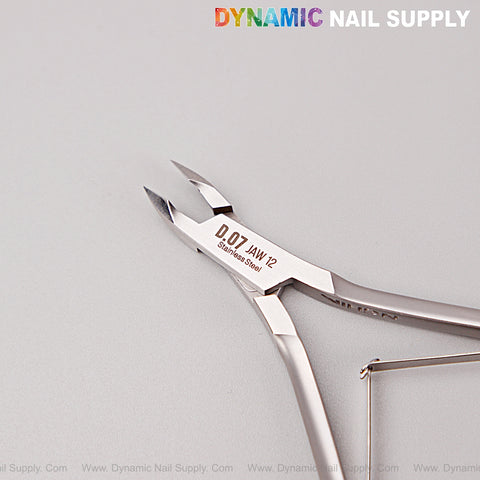 D07 - Jaw 12 Cuticle Nippers: Super fine jaw clippers with smooth spring action on light gray, perfect for manicure pedicure.