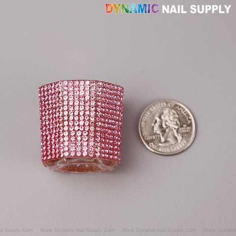 A [Pink Rhinestone] Small Cup Dappen Dish sits next to a U.S. quarter on a light gray surface.