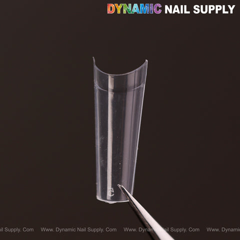 A clear, curved Medium Coffin Nail Tip Half Cover is shown with tweezers; “DYNAMIC NAIL SUPPLY” appears above.