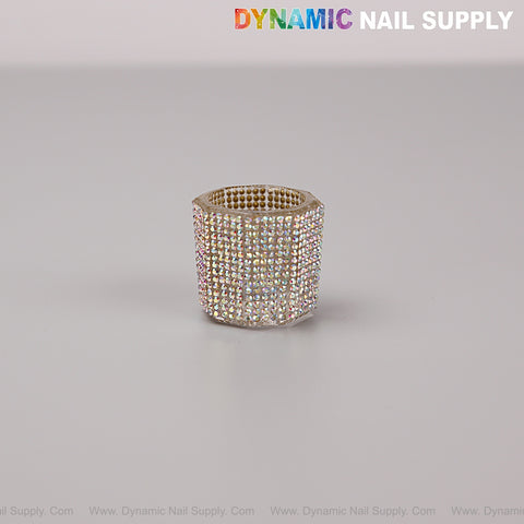 A gold-tone AB Rhinestone dappen dish cap sits on a plain gray background, sparkling with tiny rhinestones.