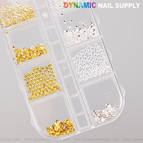 This plastic organizer holds gold and silver hollow semi-sphere beads, perfect for creative nail DIY designs.