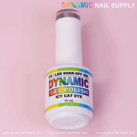 An Icy Cat Eye Gel bottle from Dynamic Nail Supply is showcased against a pink background. The white bottle prominently displays the vibrant DYNAMIC logo and contains 15 mL of Reflective Magnetic Silver gel polish. Its label emphasizes the UV/LED soak-off gel characteristics, with the brand name subtly repeated in the background.