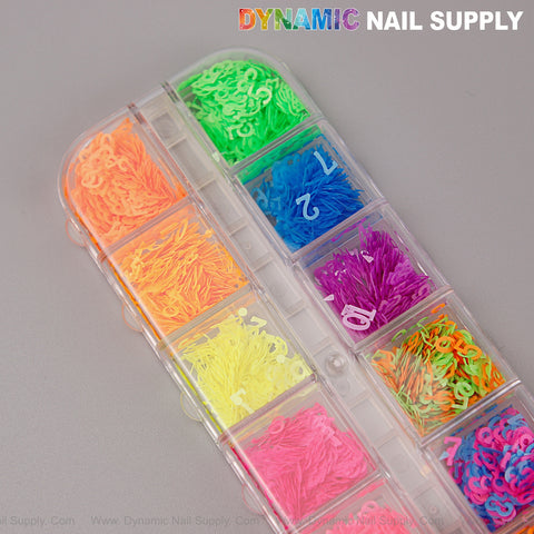 A clear case holds 10 compartments of Colorful Neon Nail Sequins Number Charms in vibrant neon shades.