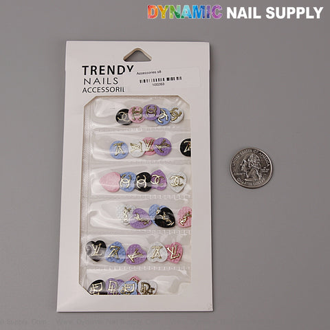 LV Logo heart-shaped resin nail charms in black, white, pink, blue & purple shown next to a US quarter for scale.