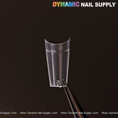 New Short Coffin Half Cover Nail Tips (600 pcs, 12 sizes) held by tweezers, DYNAMIC NAIL SUPPLY text above.