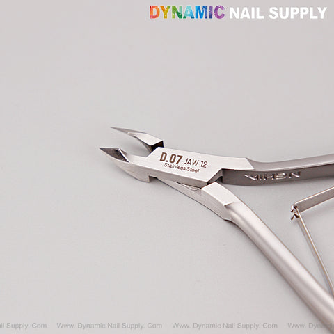 D07 - Jaw 12 Cuticle Nippers: Super Fine Jaw Clippers for precise nail care, silver with branding above on white.