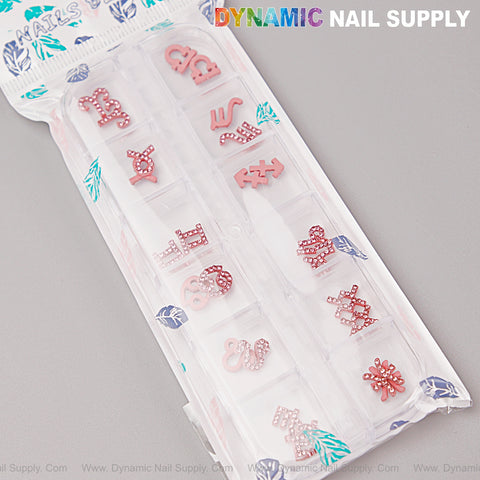 24 pcs Pink Zodiac Sign Rhinestone Nail Charms by DYNAMIC NAIL SUPPLY in a plastic organizer for nail art designs.