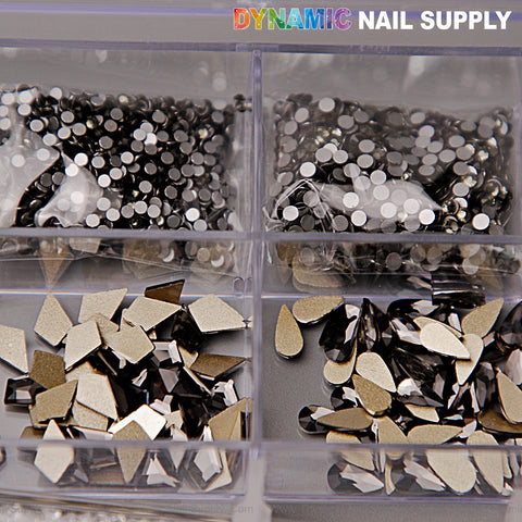 Close-up of 20-cell Black Silver-back mixed Gold-back rhinestones set with 14 big shapes and 6 round shapes for nail art.
