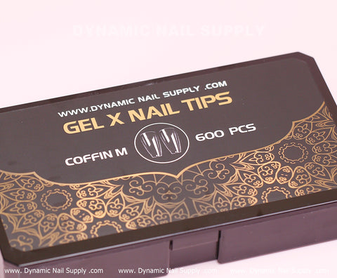 Black and gold box labeled [Coffin M] Full Cover Tips - Soft Gel X tips, 600 pcs, ornate decorative patterns.
