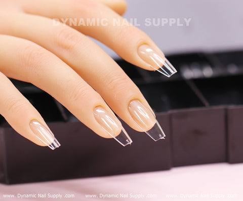 [Coffin M] Full Cover Soft Gel X Tips, 600 pcs, displayed on black tray and pale pink surface.