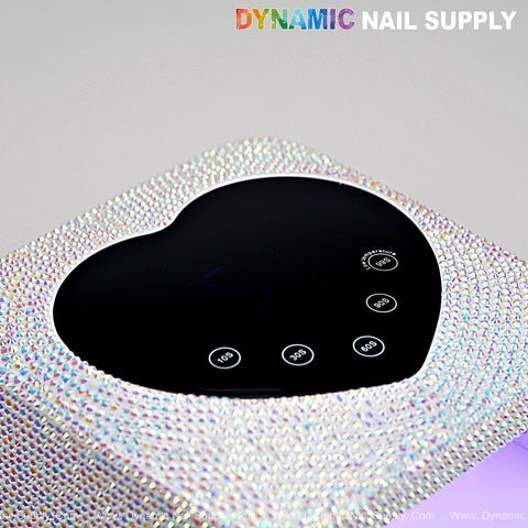 The AB Big Rhinestone UV/LED 72W Cordless Lamp features a heart display, auto sensor, and 5 timer settings.