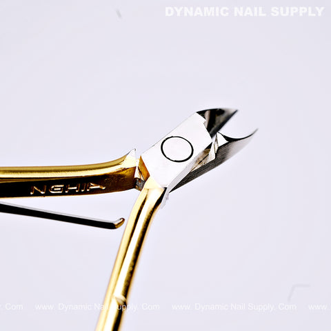D555 - Professional Cuticle Nippers: high-tension spring, full jaw, gold handle, sharp silver blades, “DYNAMIC NAIL SUPPLY” top right.