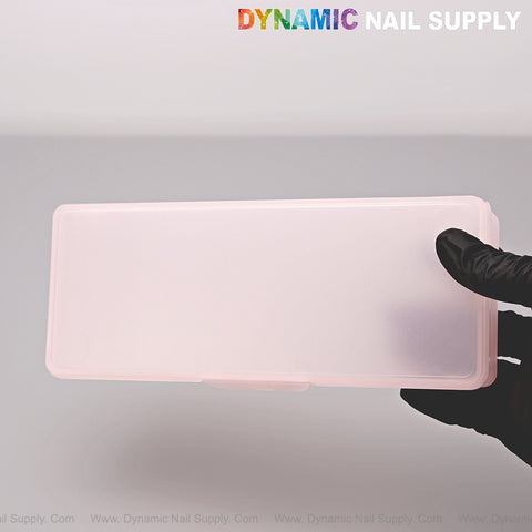 Gloved hand holds a Clear Pink Nail Brush Case; DYNAMIC NAIL SUPPLY logo is visible at the top.