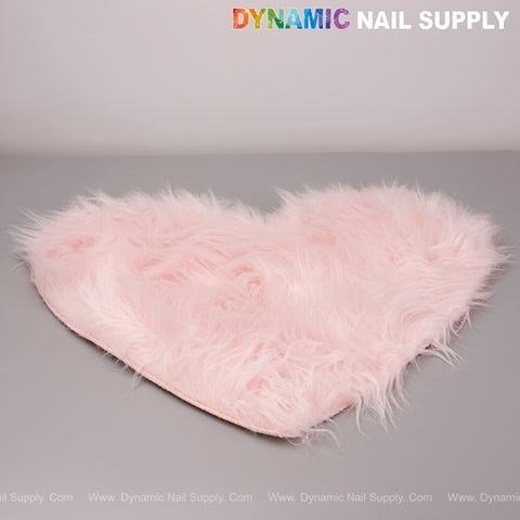 A light pink heart-shaped faux fur mat for lockers, tabletops, or nail art photos; “DYNAMIC NAIL SUPPLY” above.