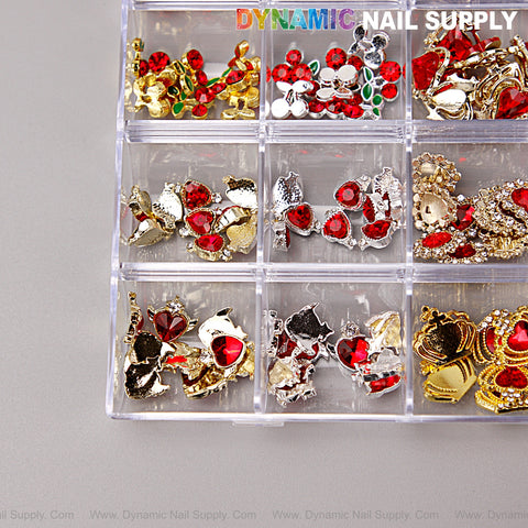 Clear box with 9 sections holds red, silver, and gold heart, cherry, crown & planet nail art charms for DIY designs.