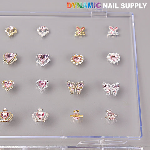 The Pink Silver Gold Heart Shape Cherry Crown Planet Charm Set Box holds 16 nail art DIY design accessories.