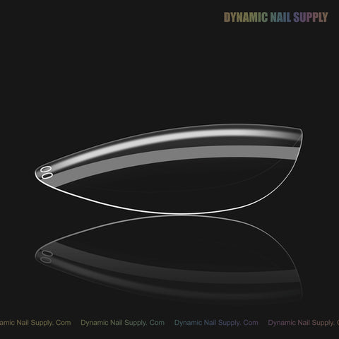 Sculpted Almond (Short) Full Cover Soft-Gel Nail Tip from Dynamic Nail Supply shown on black with logo top right.