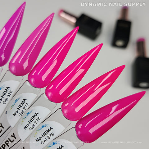 Long, pointed pink nails swatched in Dynamic No-HEMA Gel Polish 371–380, Pretty Pink Collection; black bottles behind.