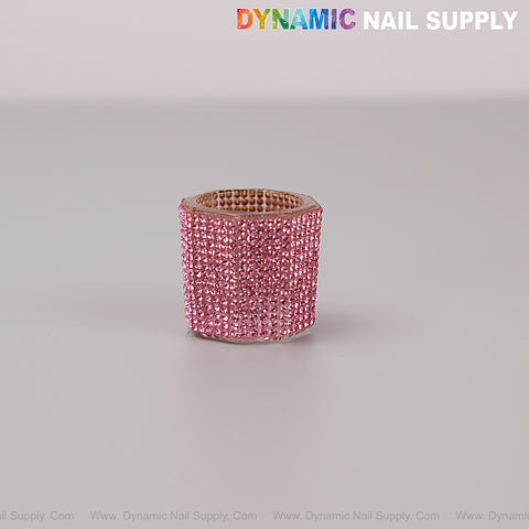 A Pink Rhinestone Small Cup Dappen Dish sits near a roll of rhinestone strip; DYNAMIC NAIL SUPPLY at the top.