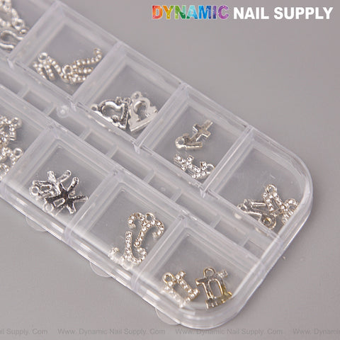 A clear case displays 24 silver rhinestone zodiac sign nail charms—perfect DIY accessories for nail art designs.