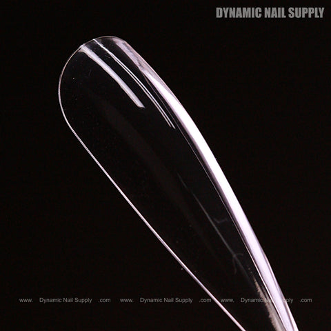 Sculpted Stiletto XL Full Cover Soft-Gel Nail Tips (Black Box) sample, glossy, shown on black with Dynamic Nail Supply text.