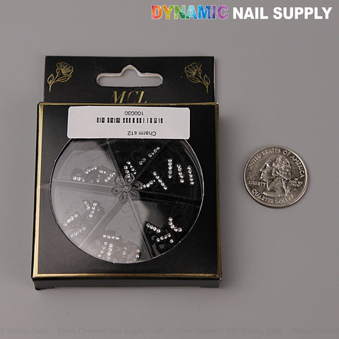 26pcs Black with Silver Rhinestone Alphabet Nail Charms (A-Z), shown in black packaging beside a U.S. quarter.