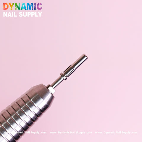 A silver nail drill bit, specifically the Small 3.5mm Easy-Off Mandrel for Smaller Sanding Band by Dynamic Nail Supply, is set against a pink background. In the top left corner, the vibrant Dynamic Nail Supply logo catches the eye. Along the bottom edge, "www.DynamicNailSupply.com" is repeatedly displayed in small text.