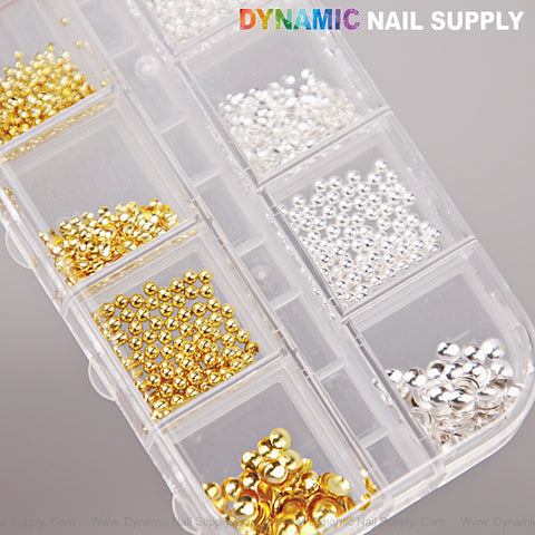 Clear organizer with gold and silver hollow semi-sphere beads, mixed size charms for nail DIY designs.