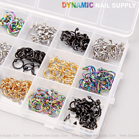 A box holds Gold, Silver, Titanium, and Black Punk Nail Charms for DIY nail art, sorted by type and color.