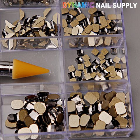 Black Silver-back mixed Gold-back rhinestone set, 20 cells with 14 big and 6 round shapes, shown with nail tool.
