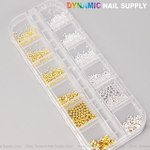 A clear organizer holds DYNAMIC NAIL SUPPLY Gold and Silver Hollow Semi-Sphere Beads for nail DIY designs.