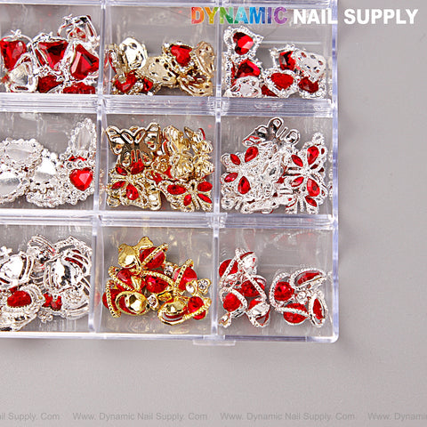 The Red Silver Gold Heart Shape Cherry Crown Planet Charm Set Box has 12 compartments with assorted nail art charms.